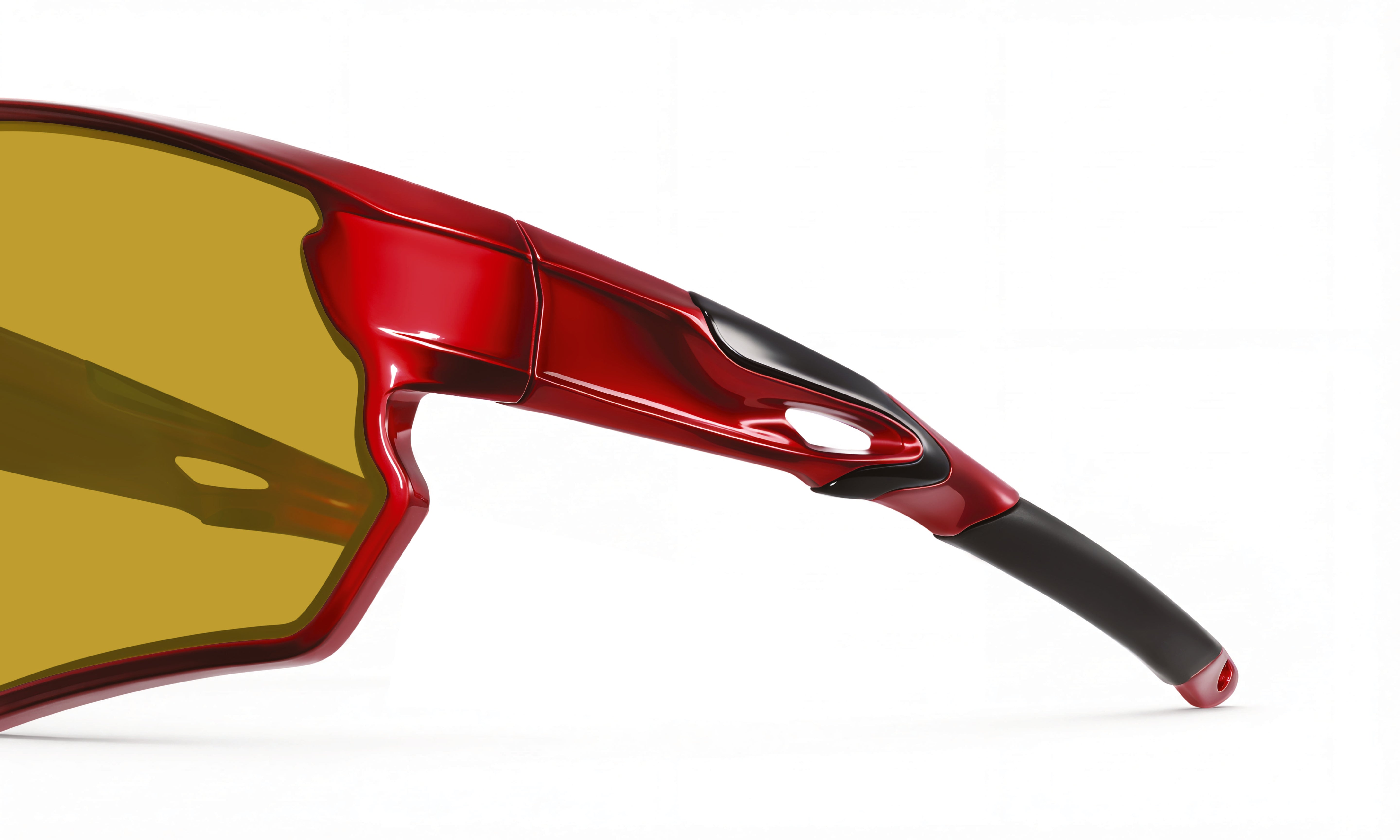 Red cycling sunglasses with yellow lenses and aerodynamic frame close-up