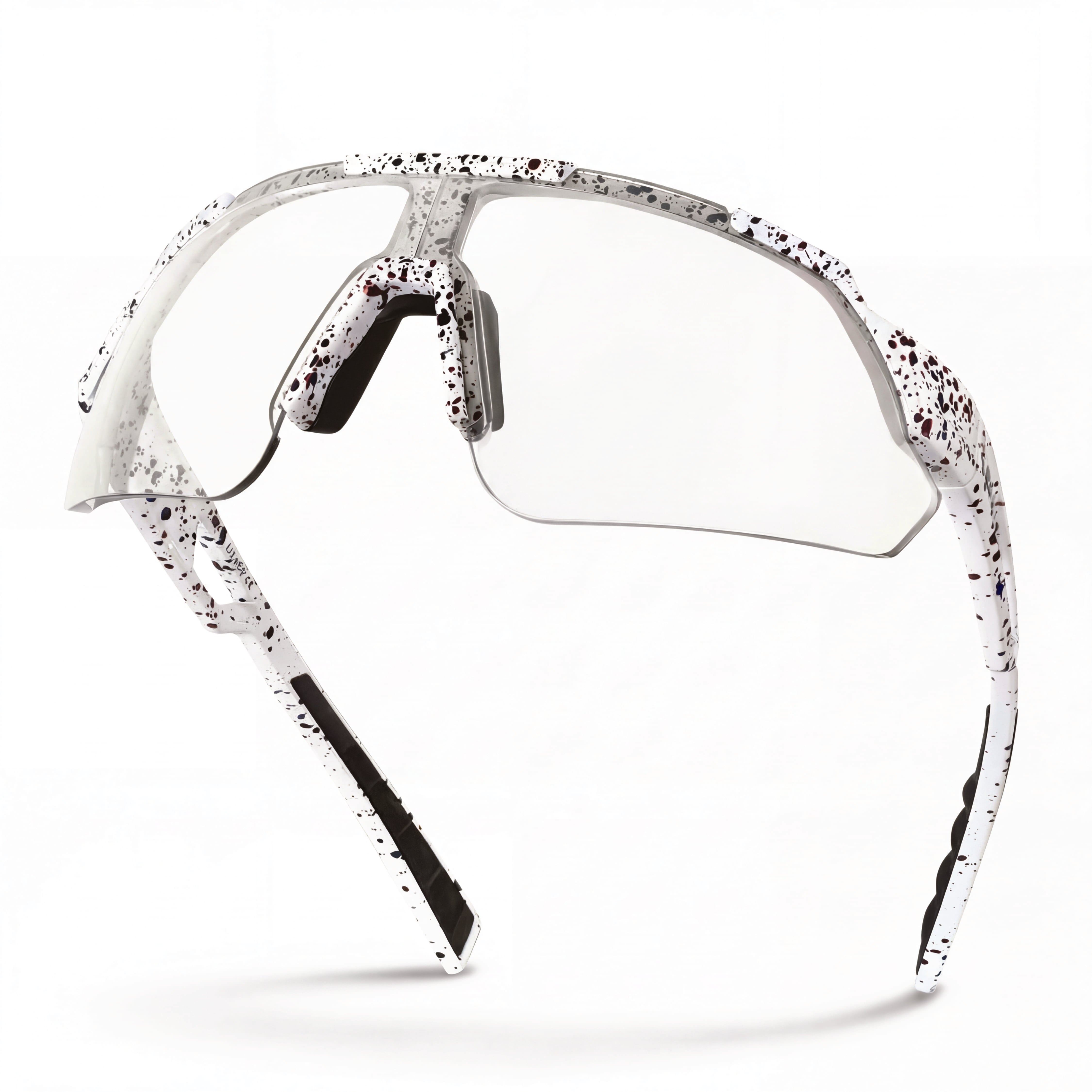 Clear lens cycling sunglasses with white and black splatter frame, side profile view