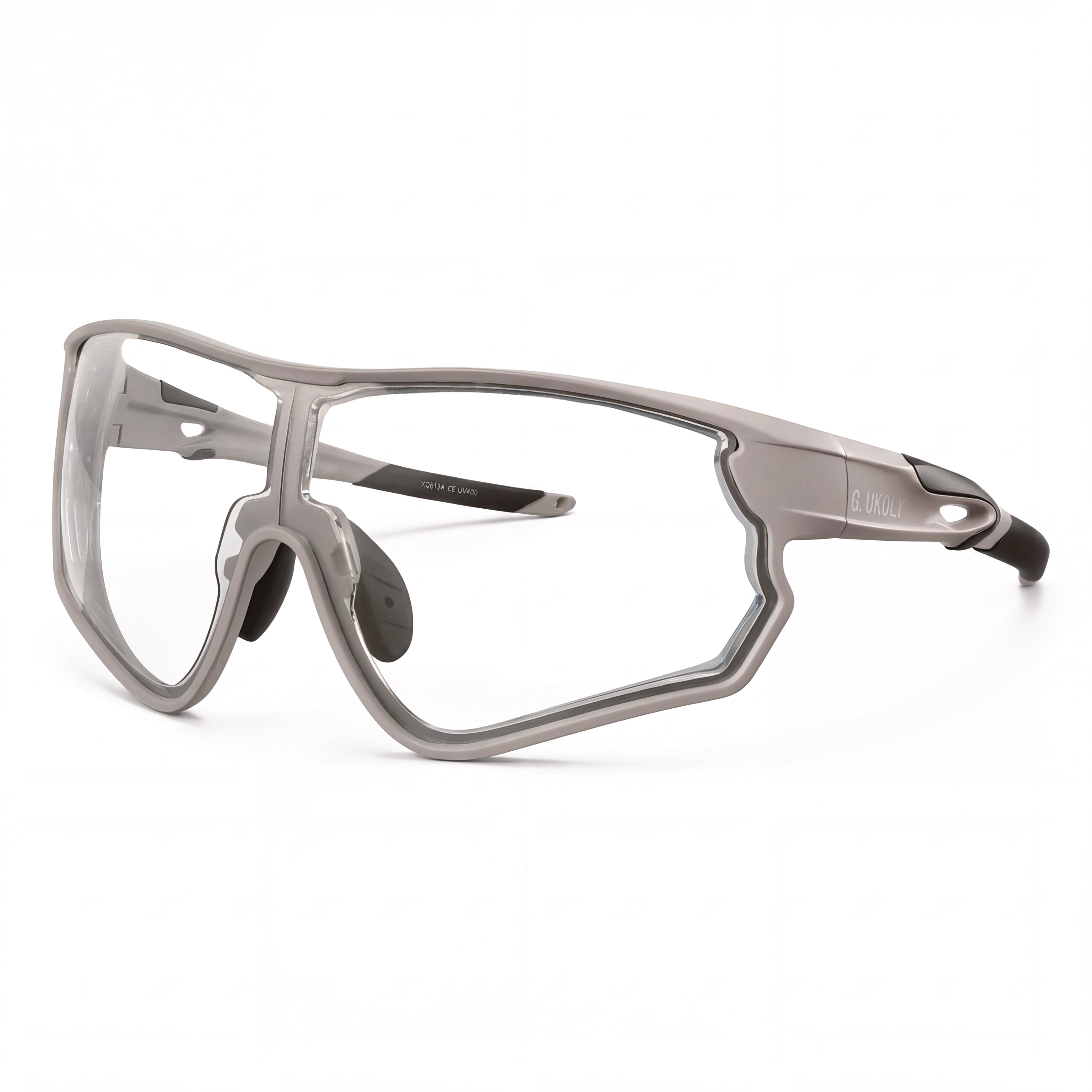 Clear prescription cycling sunglasses with large angular frame and black temple tips on white background