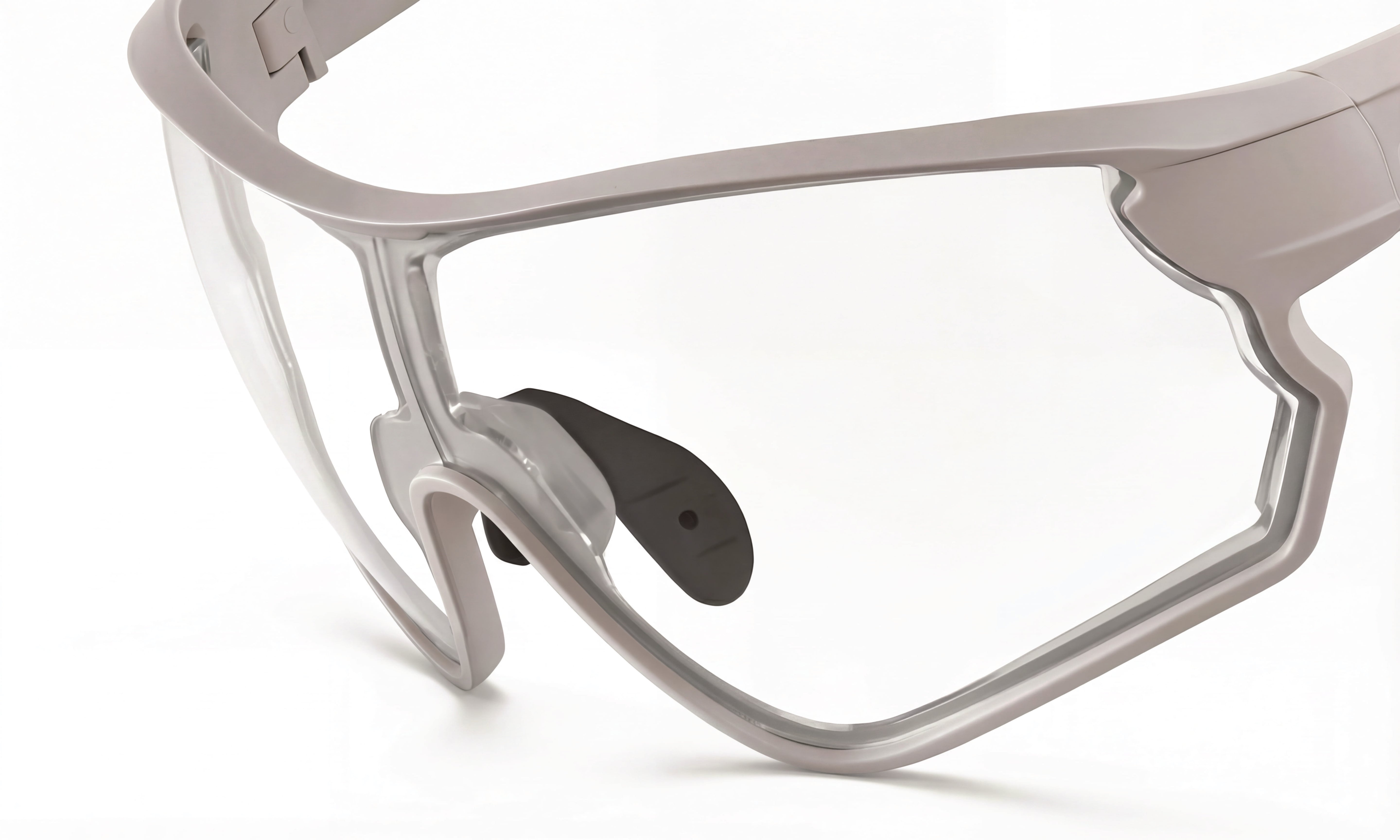 Close-up of performance cycling sunglasses with clear RX lenses and aerodynamic frame
